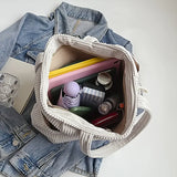 Tilda™ | Riflet taske med snordetalje